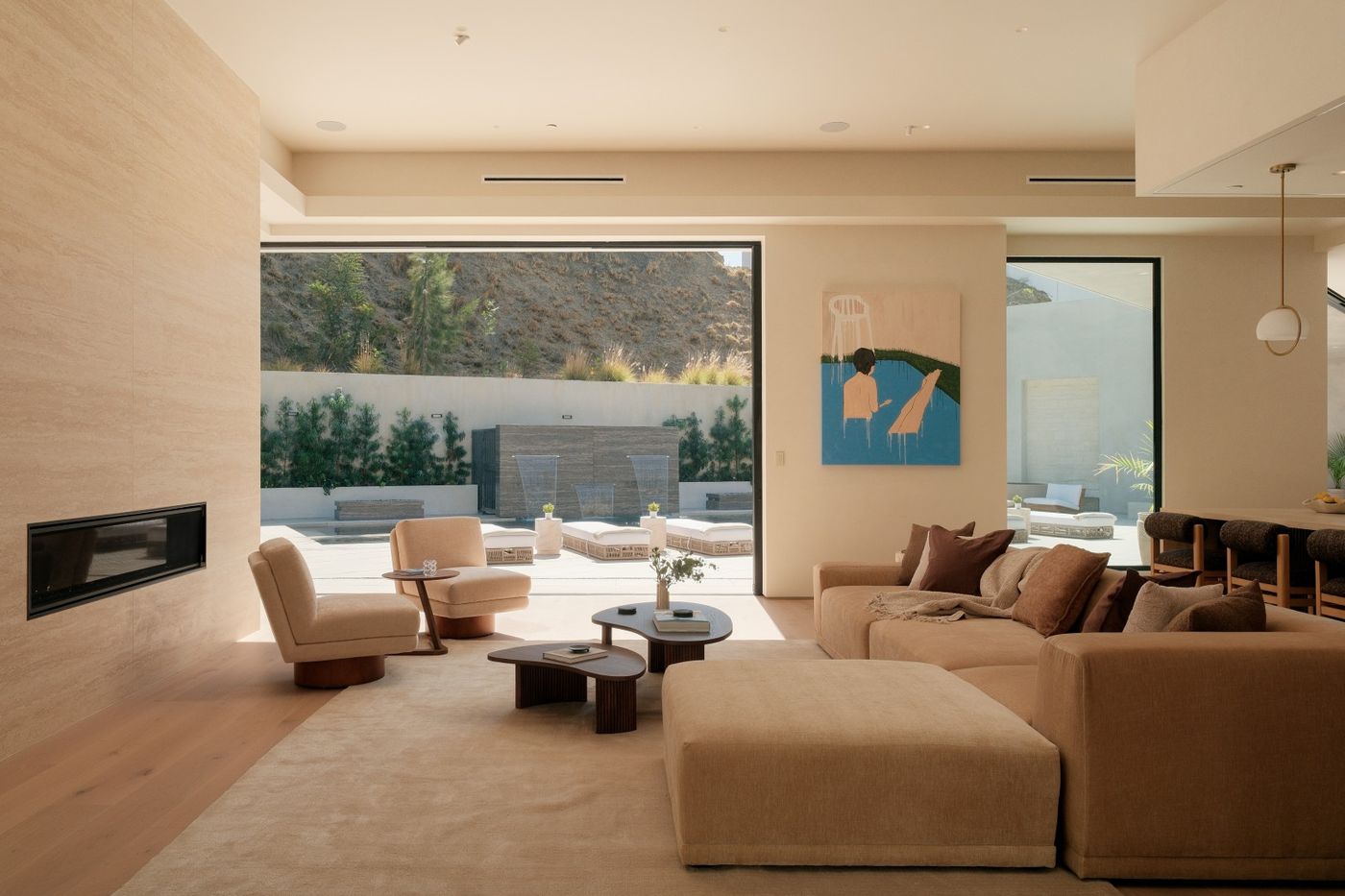 Living room with floor-to-ceiling glass opening to the yard at 2630 Algodon Ct